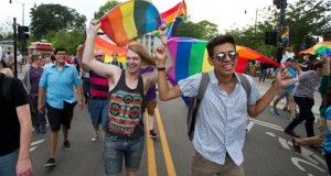 A.J. Blanchet, middle left, of Madison, and Dallas Peters, right, of Madison, march down King Street in Madison, Wis., during a rally Friday, June 26, 2015. Gay marriage has been legal in Wisconsin for months, but supporters still trumpeted a U.S. Supreme Court ruling Friday legalizing same-sex marriage nationwide with relief and joy, saying it cements same-sex unions in the state. (AP Photo/Wisconsin State Journal, Steve Apps)