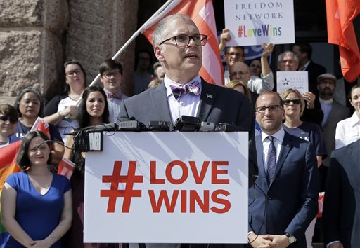 Jim Obergefell, the named plaintiff in the Obergefell v. Hodges Supreme Court case that legalized same sex marriage nationwide, is backed by supporters of the courts ruling on same-sex marriage on the step of the Texas Capitol during a rally in Austin, Texas. The Supreme Court declared that same-sex couples have a right to marry anywhere in the United States. It was 2004 when Massachusetts became the first state to allow same-sex couples to marry. Eleven years later, the Supreme Court has now ruled that all those gay marriage bans must fall and same-sex couples have the same right to marry under the Constitution as everyone else. (AP Photo/Eric Gay)