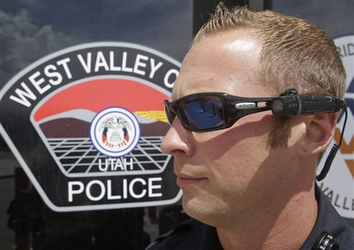 Sgt. Mike Fossmo, of the West Valley City Police, wearing a video camera on his eyeglasses during a demonstration, in West Valley City, Utah. As more police agencies issue body cameras to their officers, Utah needs to set statewide standards about what should be filmed and who can see it, lawmakers and advocates said Tuesday, July 7, 2015. (AP Photo/Rick Bowmer, File)