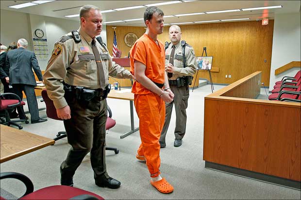 Construction worker Aaron Schaffhausen, who killed his three daughters last year in an act of revenge against his ex-wife, is led from a St. Croix County Courtroom after being sentenced to three consecutive life terms in prison on July 15 in Hudson. The Schaffhausen home was auctioned off Tuesday, but no one bid. (AP Photo/The Star Tribune, Elizabeth Flores)