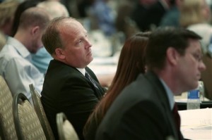 Sitting with aides, Wisconsin Attorney General Brad Schimel listens during a panel session on open records during an Open Government Summit his office hosted at the Madison Concourse Hotel in Madison, Wis., Wednesday, July 29, 2015. (Michael P. King/Wisconsin State Journal via AP)