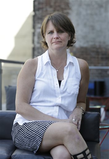 First amendment lawyer Liz McDougall poses for a picture in New York, Tuesday, Aug. 4, 2015. McDougall is general counsel for the company that runs the classified ad website Backpage.com. Backpage has been the target of lawsuits and high-profile campaigns aimed at persuading the company to drop its adult ads, which have been used by sex traffickers. She says the website is actually one of the good guys, working with law enforcement behind the scenes to help save adult and child victims and put their traffickers behind bars. (AP Photo/Seth Wenig)