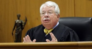 Waukesha County Circuit Judge Michael Bohren speaks at a Waukesha County court in Waukesha, Wis., Monday, Aug. 10, 2015. The judge ruled that two girls accused of stabbing a classmate to please the online horror character Slender Man will stay in adult court, where they could face decades in prison. (Mike De Sisti/Milwaukee Journal Sentinel via AP, Pool)