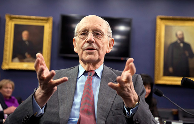 U.S. Supreme Court Associate Justice Stephen Breyer talks as he waits for the start of a committee hearing to review the Supreme Court's FY 2016 budget request on March 23 on Capitol Hill in Washington. Breyer said that doing his best means trying to explain how the court works in a way that people who are not lawyers can understand. (AP Photo/Manuel Balce Ceneta, File)