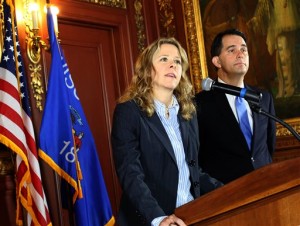 Judge Rebecca Bradley makes remarks to members of the media after it was announced that she was being appointed to the Wisconsin Supreme Court by Governor Scott Walker, rigth, at the State Capitol in Madison, Wis. Friday, Oct. 9, 2015. Bradley, 44, who had previously announced her candidacy for the seat of retiring Justice Patrick Crooks, was tabbed by Walker to fill the unexpected vacancy on the court after Crooks died in September. (John Hart/Wisconsin State Journal via AP)