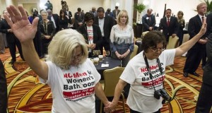 Rita Palomarez, left, and Linda Rodriguez pray during an election watch party attended by opponents of the Houston Equal Rights Ordinance on Tuesday, Nov. 3, 2015, in Houston. The ordinance that would have established nondiscrimination protections for gay and transgender people in Houston did not pass. (Brett Coomer/Houston Chronicle via AP)
