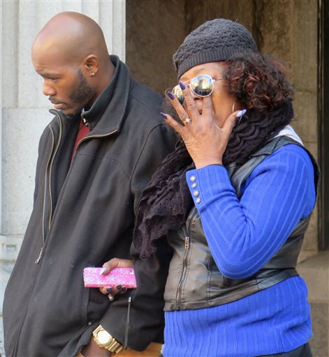 Nate Hamilton and his mother, Maria Hamilton, attend a news conference in Milwaukee, Wis. on Tuesday, Nov. 10, 2015. The U.S. Justice Department said Tuesday it wouldn't pursue criminal civil rights charges against Christopher Manney, a white Milwaukee police officer, who shot Dontre Hamilton, a mentally ill black man, 14 times in a city park in 2014. Dontre was Nate’s brother and Maria’s son. (AP Photo/Greg Moore)