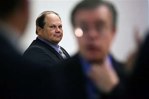 Eddie Tipton looks over at his lawyers before the start of his trial in Des Moines, Iowa. The former security director of the Multi-State Lottery Association, accused of tampering with lottery drawings to rig jackpots in four states, was convicted of fraud in the attempt to claim a $16.5 million jackpot in Iowa. Investigators are now looking at payouts in 37 other states and U.S. territories that used random-number generators from the Iowa-based association, which administers games and distributes prizes for the lottery consortium. (Brian Powers/The Des Moines Register, File)