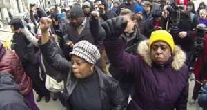 protestors march in Milwaukee after authorities announced a white Milwaukee police officer who fatally shot a mentally ill black man in April won't face criminal charges. The U.S. Justice Department said Tuesday, Dec. 15, 2015 that it’s prepared to announce a collaborative plan to significantly reform the Milwaukee Police Department. (AP Photo/Carrie Antlfinger, File)