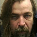 Brian T. Flatoff, 45, who faces several felony charges from what authorities say preceded a four-hour standoff Saturday, Dec. 5, at Eagle Nation Cycles in Neenah, Wis., in which a man was killed and an officer had a bullet bounce off his helmet. (Winnebago County Court/The Oshkosh Northwestern via AP)