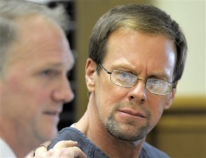 Mark Jensen looks at his attorney Craig Albee during his bond hearing on Wednesday, Jan. 6, 2016, in Kenosha, Wis. A judge set a $1.2 million bond Wednesday for Jensen,a Wisconsin man once convicted in his wife's death after prosecutors said he poisoned her with antifreeze. Jensen was found guilty and sentenced to life in prison in 2008, but recently won appeals that set up a retrial in Kenosha County. (Sean Krajacic/Kenosha News via AP)