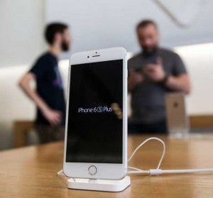 An Apple iPhone 6s Plus smartphone is displayed Friday, Sept. 25, 2015 at the Apple store at The Grove in Los Angeles. On Wednesday, Feb. 17, 2016, a federal judge ordered Apple Inc. to help the FBI hack into an encrypted iPhone used by Syed Farook, who along with his wife, Tashfeen Malik, killed 14 people in December in the worst terror attack on U.S. soil since Sept. 11, 2001. Apple has helped the government before in this and previous cases, but this time Apple CEO Tim Cook said no and Apple is appealing the order. (AP Photo/Ringo H.W. Chiu)