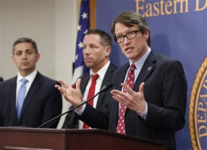 Benjamin Wagner, right, the United States Attorney for the Eastern District of California, discusses the charges filed against Helaman Hansen for allegedly running a scam that offered adult adoptions as a pathway to U.S. citizenships, at a news conference Thursday, Feb. 11, 2016, in Sacramento, Calif. Hansen, 63, of Elk Grove, was arrested Thursday and indicted on conspiracy and fraud charges. At left is Manny Alvarez, FBI Assistant Special Agent in Charge Manny Alvarez, and Ryan Spradlin, center, special agent in charge for Homeland Security Investigations in San Francisco.(AP Photo/Rich Pedroncelli)