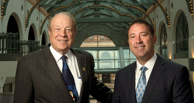 Michael Hupy (left) and Jason Abraham stand in the lobby of the Milwaukee Center in Milwaukee recently. Before the firm could afford to hire William Shatner for their advertisements, the founders ofHupy and Abraham found other ways to generate referrals. Below: William Shatner in Hupy and Abraham TV commercial. (Staff Photo by Kevin Harnack)