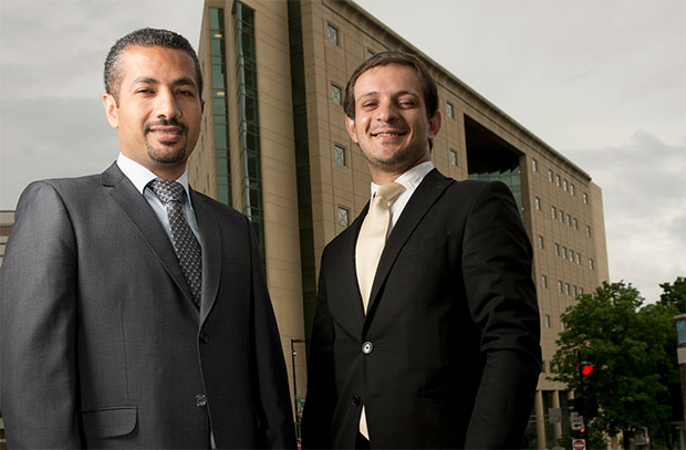 Jordanian lawyers Jamal Feroun (left) and Ali Al-Saber stand outside the Dane County Courthouse on Friday in Madison. The two were selected to take part in the Justice Center for Legal Aid’s Wisconsin Public Defenders Office Internship Program and hope to share what they have learned in Wisconsin when they return home. (Staff photo by Kevin Harnack)