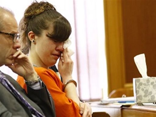 Ashlee Martinson wipes away tears while watching a video clip during her sentencing Friday, June 10, 2016, at Oneida County Courthouse in Rhinelander, Wis. Next to Martinson is her defense attorney Thomas Wilmouth. (T'xer Zhon Kha/USA TODAY NETWORK-Wisconsin via AP)