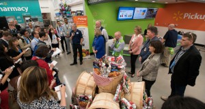 Greg Foran, president of Walmart US, leads a tour of a store in Fayetteville, Ark., on June 2. A new type of law firm is coming to Walmart stores across the U.S. (J.T. Wampler/The Arkansas Democrat-Gazette via AP)