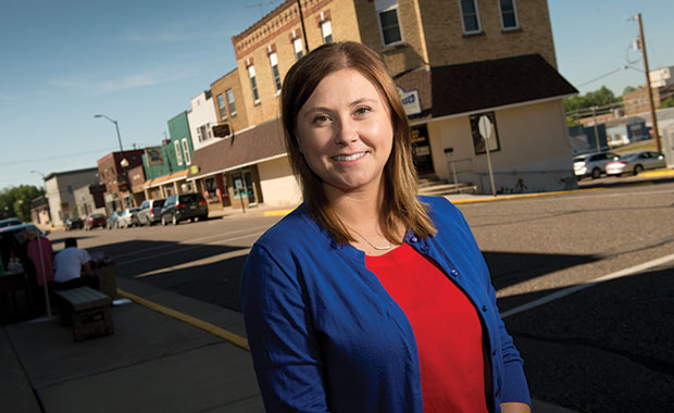 Courtney Graff stands on Medford’s Main Street. Graff has settled into small-town living and the small-town firm of Schmiege & Graff Law Office. (Staff photo by Kevin Harnack)