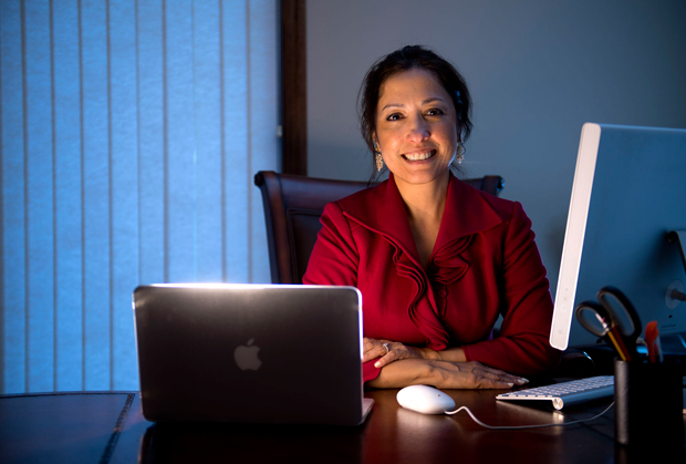 Attorney Priya Barnes uses a Macintosh computer while at her Pewaukee office recently. Barnes believes that Macs are easier to use and a good choice for attorneys who are not overly tech savvy. (Staff photo by Kevin Harnack)