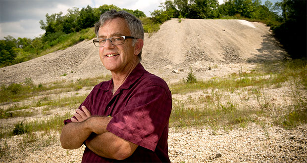 Grafton-based attorney Bruce McIlnay stands in an abandoned Richfield quarry on property belonging to his clients, Danah and Thomas Zoulek, who want to fill the quarry and eventually turn it into residential lots. McIlnay is representing the Zouleks in a dispute with Richfield over whether they need local approval on top of state permits to operate a clean fill dump site at the former quarry. (Staff photos by Kevin Harnack)