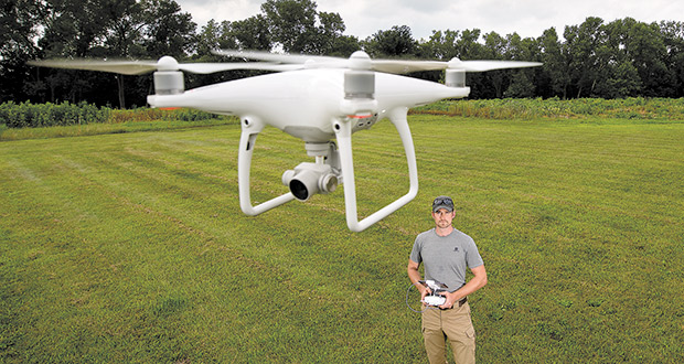 Jim Barmore, owner of Harrier GeoGraphics & Construction, flies a drone at Festge County Park in Cross Plains. Drone flights are just one of the high-tech services Barmore provides that can help lawyers in property-rights cases visually tell their clients’ stories to juries. (Staff photo by Kevin Harnack)