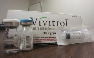This Oct. 19, 2016 photo taken at Family Guidance Center, an addiction treatment center in Joliet, Ill, shows the packaging of Vivitrol, a high-priced monthly injection used to prevent relapse in opioid abusers. U.S. prisons are experimenting with the medication, which could help addicted inmates stay off heroin and other opioid drugs after they are released. (AP Photo/Carla K. Johnson)