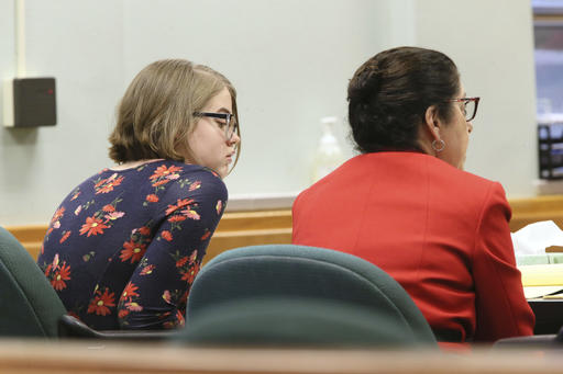 Morgan Geyser, left, listens as Donna Kuchler, one of her lawyers, questions Waukesha Police Department Detective Thomas Casey, during a hearing on motions in the so called Slenderman stabbing case at Waukesha County Courthouse in front of Judge Michael Bohren Monday, Dec. 12, 2016 in Waukesha, Wis. (Michael Sears/Milwaukee Journal-Sentinel via AP)