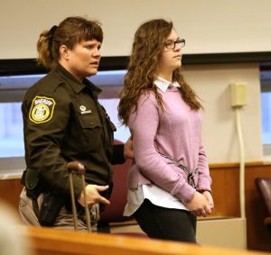 Anissa Weier is escorted into the courtroom for a hearing at Waukesha County Circuit Court, Thursday, Dec. 22, 2016, in Waukesha, Wis. Weier and Morgan Geyser are accused of trying to kill their classmate as a sacrifice to horror character Slender Man. (Michael Sears/Milwaukee Journal-Sentinel via AP)