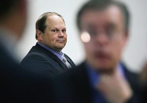 Eddie Tipton, former security director of the Multi-State Lottery Association, looks toward his lawyers before the start of his trial in July 2015 in Des Moines, Iowa. Tipton is charged with using software installed on lotteries' random-number generators to allow him to predict winning numbers on three days of the year. The scheme is believed to have lasted for years. A proposed class-action lawsuit filed against the Multi-State Lottery Association on Wednesday alleges that thousands of lottery players who are believed to have been cheated by the insider's long-running scheme should be reimbursed for their losing tickets. (Brian Powers/The Des Moines Register via AP, File)