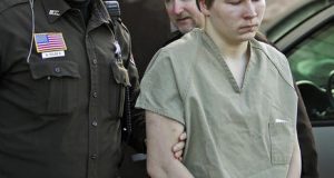 FILE - In this March 3, 2006, file photo, Brendan Dassey is escorted out of a Manitowoc County Circuit courtroom in Manitowoc, Wis. A federal appeals court is about to consider the fate of the Wisconsin inmate featured in the Netflix series "Making a Murderer." Dassey was sentenced to life in prison in 2007 in the death of photographer Teresa Halbach two years earlier. Dassey told detectives he helped his uncle, Steven Avery, rape and kill Halbach in the Avery family's Manitowoc County salvage yard. (AP Photo/Morry Gash, File)