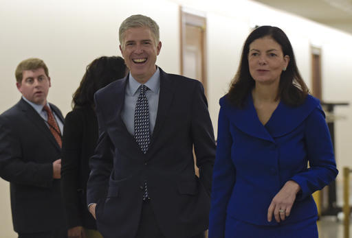 Supreme Court nominee Judge Neil Gorsuch, center, arrives with former New Hampshire Sen. Kelly Ayotte on Capitol Hill in Washington, Thursday, Feb. 2, 2017, for a meeting with Sen. Bob Corker, R-Tenn. (AP Photo/Susan Walsh)