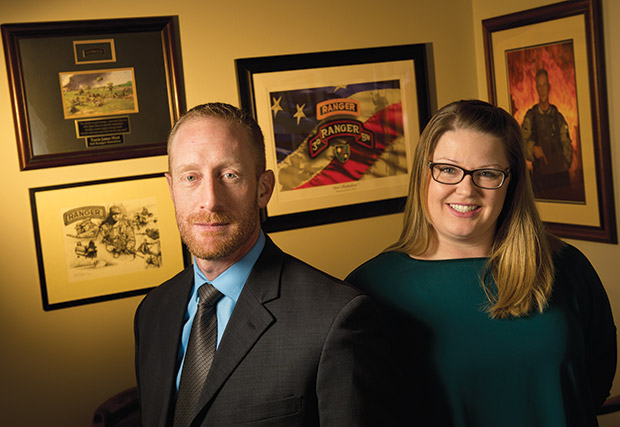 Travis West and Shana Dunn of West & Dunn are surrounded by West’s Army memorabilia inside the firm’s offices in Waunakee. The attorneys have transformed the firm into a full-service veterans’ disability law operation. (Staff photos by Kevin Harnack)