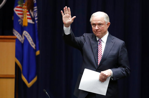 Attorney General Jeff Sessions waves as he arrives for a meeting of the Attorney General's Organized Crime Council and Organized Crime Drug Enforcement Task Forces (OCDETF) Executive Committee to discuss implementation of the President's Executive Order 13773, Tuesday, April 18, 2017, at the Justice Department in Washington. (AP Photo/Alex Brandon)