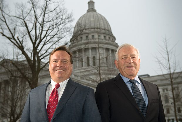Wisconsin State Bar President candidates Chris Rogers (left) and Jon Axelrod stand near the state Capitol on April 5 in Madison. (Staff photos by Kevin Harnack)