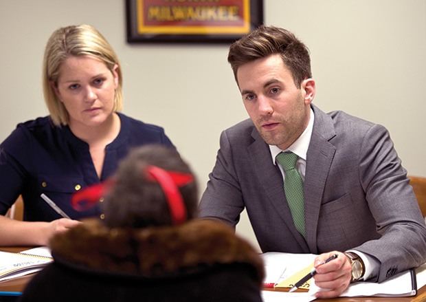 Jillian Lukens (left), a Marquette law student, and Zach Eastburn, a lawyer with Quarles & Brady, work with a client at the Eviction Defense Project, a weekly eviction clinic at the Milwaukee County Courthouse run by Legal Action of Wisconsin. Legal Action may have to shut down the clinic and other programs that are part of its Volunteer Lawyers Project if U.S. lawmakers choose to eliminate the Legal Services Corp. (Staff photos by Kevin Harnack)