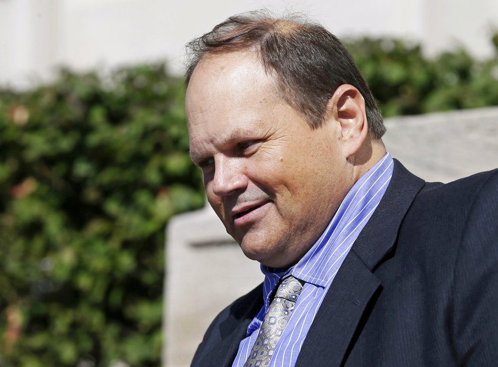 FILE - In this Sept. 9, 2015, file photo, former Multi-State Lottery Association security director Eddie Tipton leaves the Polk County Courthouse in Des Moines, Iowa, after his sentencing in a jackpot-fixing scandal. Tipton, a lottery computer programmer, will tell investigators how he was able to use his position to rig state jackpots for years and he and his brother will repay $3 million in prizes they improperly claimed, under a plea agreement released Monday, June 12, 2017. (AP Photo/Charlie Neibergall, File)