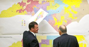 North Carolina Republican state Sens. Dan Soucek (left) and Brent Jackson review historical maps during The Senate Redistricting Committee for the 2016 Extra Session in the Legislative Office Building in Raleigh, N.C., in February 2016. An Associated Press analysis, using a new statistical method of calculating partisan advantage, finds traditional battlegrounds such as Wisconsin were among those with significant Republican advantages in their U.S. or state House races in 2016. (Corey Lowenstein/The News & Observer, File via AP)