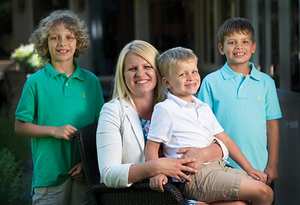 Foley & Lardner’s Jessie Lochmann Allen sits with her sons — JJ (from left), Jonah and Jett — at their home on June 1. Allen, who took three six-month maternity leaves in four years, says to “start dialogue internally at the law firm as soon as you feel comfortable.” (Staff photo by Kevin Harnack)