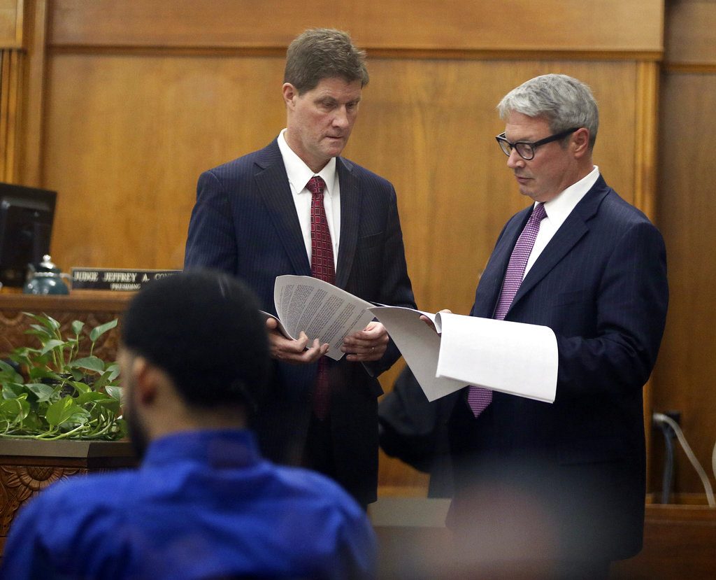 Milwaukee County District Attorney John Chisholm, left, confers with Milwaukee police officer Dominique Heaggan-Brown's attorney Jonathan C. Smith, right, during Heaggan-Brown's trail in Milwaukee on Wednesday, June 14, 2017, in Milwaukee. Dominique Heaggan-Brown is charged with first-degree reckless homicide in the death of 23-year-old Sylville Smith. (Michael Sears/Milwaukee Journal-Sentinel via AP, Pool)