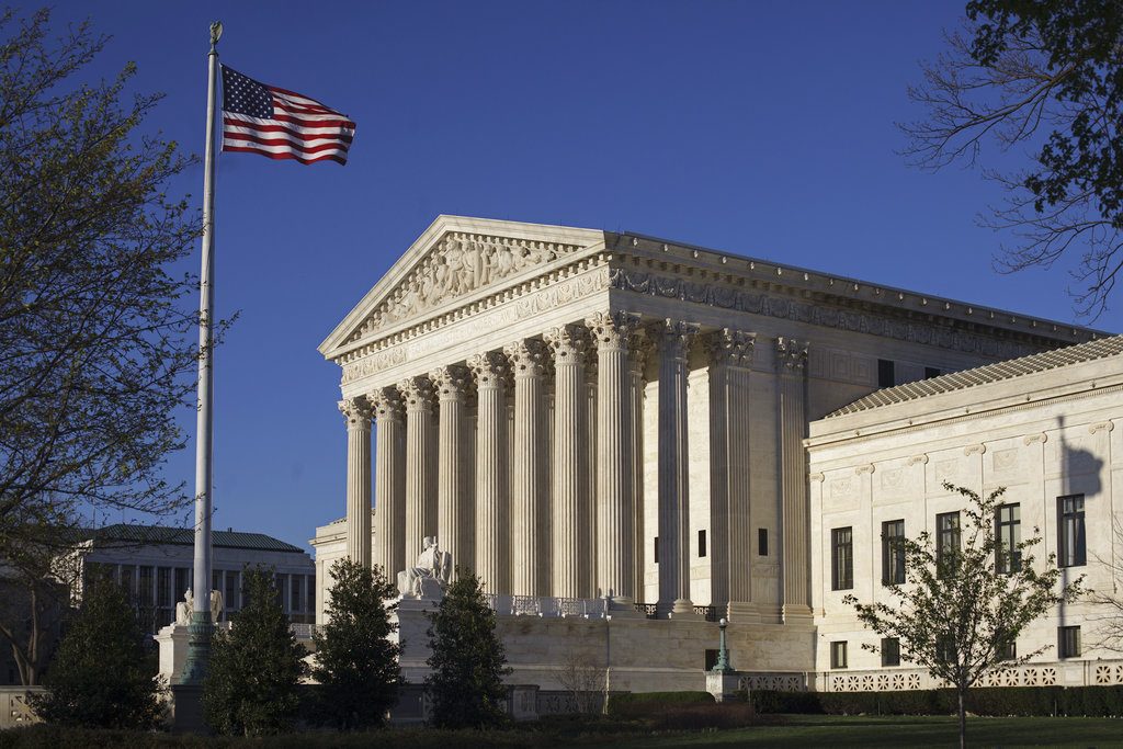 FILE - In this April 4, 2017, file photo, the Supreme Court Building is seen in Washington. In an era of deep partisan division, the Supreme Court could soon decide whether the drawing of electoral districts can be too political. A dispute over Wisconsin’s Republican-drawn boundaries for the state legislature offers Democrats some hope of cutting into GOP electoral majorities across the United States.(AP Photo/J. Scott Applewhite, File)