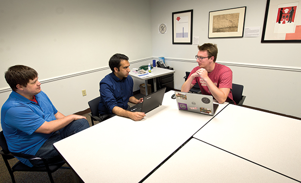 Supervising attorney Jeff Glazer, left, and law student Emaad Moinuddin, center, work with their client, Kyle Treige, on a start up business that is the focus of a high school curriculum project Aug. 10 at the University of Wisconsin Law School’s Law and Entrepreneurship Clinic in Madison. The clinic is one way the law school prepares students with skills that can be helpful for working as in-house attorneys. (Staff photo by Kevin Harnack)