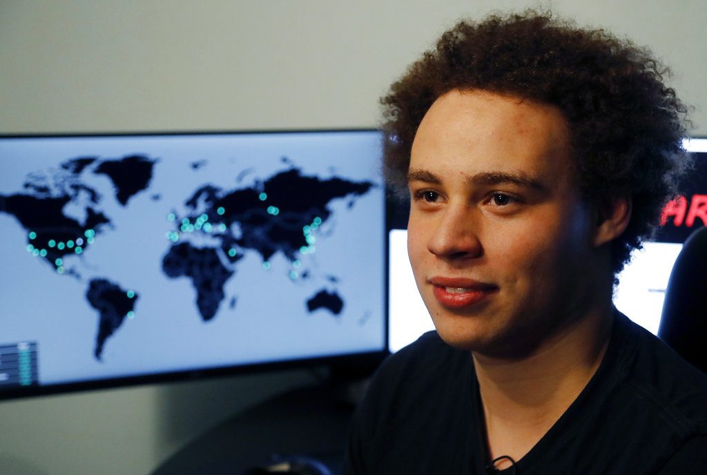 FILE - This Monday, May 15, 2017, file photo shows British IT expert Marcus Hutchins, branded a hero for slowing down the WannaCry global cyberattack, during an interview in Ilfracombe, England. On Friday, Aug. 4, 2017, a computer law expert described the evidence so far presented to justify Hutchins' arrest in Las Vegas earlier in the week for allegedly creating and selling malicious banking software, as being problematic. (AP Photo/Frank Augstein, File)