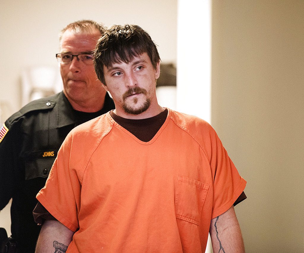 FILE - In this April 25, 2017, file photo, Joseph Jakubowski is escorted into a room at the Rock County Courthouse for his preliminary hearing in Janesville, Wis. Jakubowski, who is accused of stealing an arsenal of firearms from a southern Wisconsin gun shop and sending an anti-government manifesto to President Donald Trump, is set to go on trial in federal court in Madison beginning Monday, Sept. 25, 2017. (Angela Major/The Janesville Gazette via AP, File)
