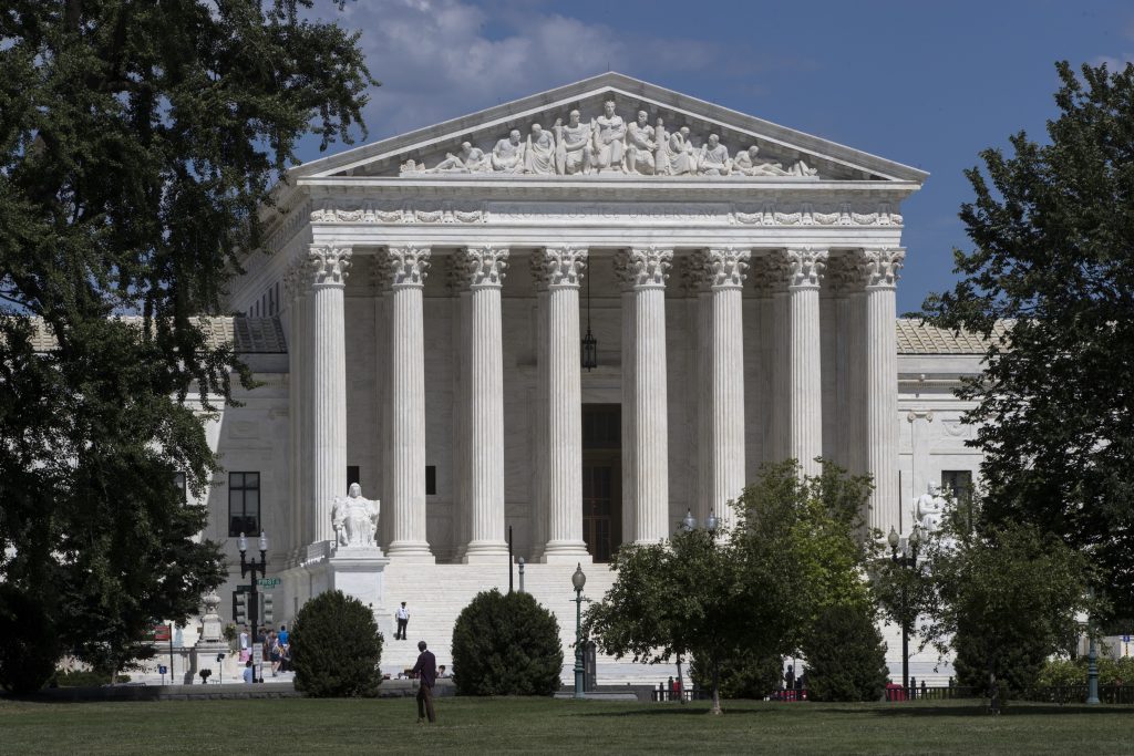 The Supreme Court building in Washington. The court is taking up a case about political maps in Wisconsin that could affect elections across the country. The justices are hearing arguments on Oct. 3 in a dispute between Democratic voters and Wisconsin Republicans who drew maps that have entrenched their control of the legislature in a state that is otherwise closely divided between the parties. (AP Photo/J. Scott Applewhite, File)