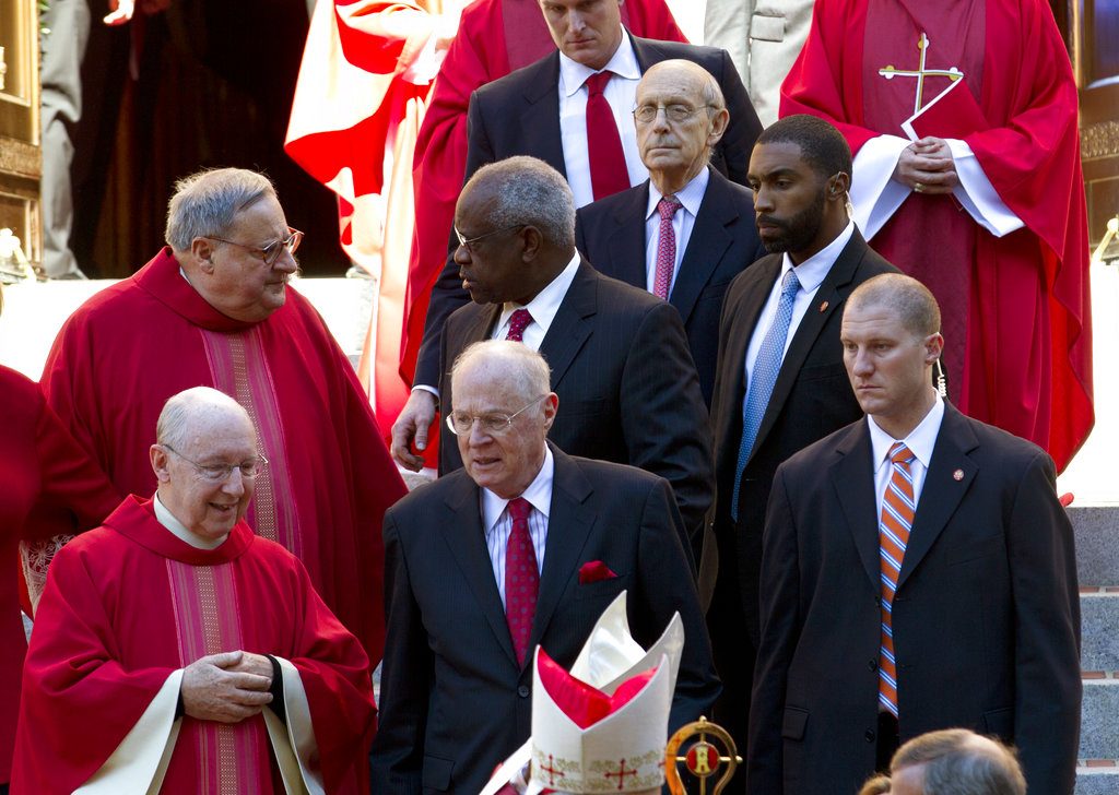 U.S. Supreme Court Justices Stephen Breyer, top, Clarence Thomas, center, and Anthony Kennedy, leave St. Mathews Cathedral, after the Red Mass in Washington on Sunday, Oct. 1, 2017. The Supreme Court's new term starts Monday, Oct. 2. (AP Photo/Jose Luis Magana)