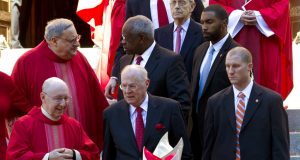 U.S. Supreme Court Justices Stephen Breyer, top, Clarence Thomas, center, and Anthony Kennedy, leave St. Mathews Cathedral, after the Red Mass in Washington on Sunday, Oct. 1, 2017. The Supreme Court's new term starts Monday, Oct. 2. (AP Photo/Jose Luis Magana)