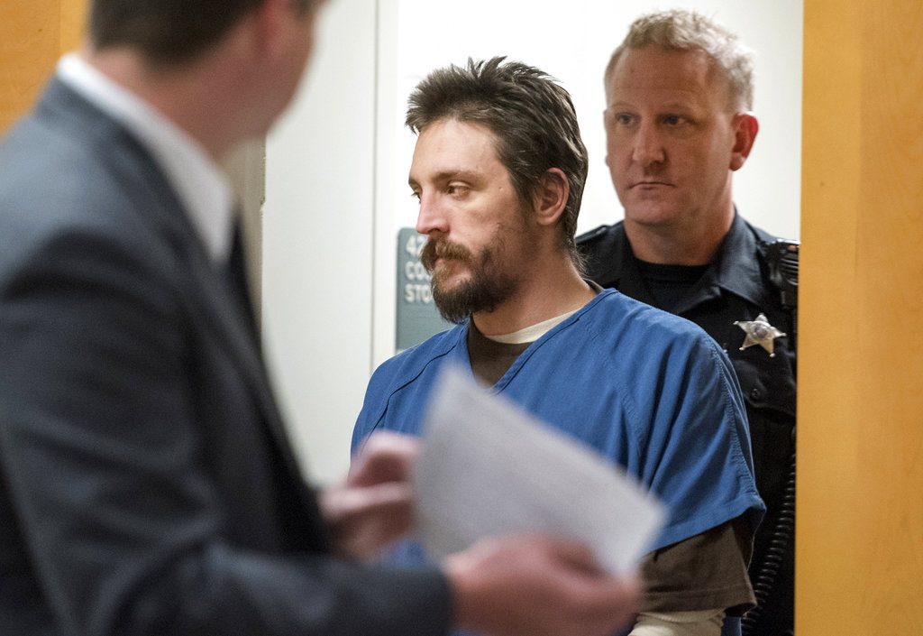 FILE - In this Oct. 19, 2017 file photo, Joseph Jakubowski is escorted into a courtroom at the Rock County Courthouse in Janesville, Wis. Jakubowski, who stole a cache of firearms from a gun shop and sent a rambling anti-government manifesto to President Donald Trump before going on the run, faces up to 20 years in federal prison when he is sentenced Wednesday, Dec. 20, 2017. (Angela Major/The Janesville Gazette via AP, File)