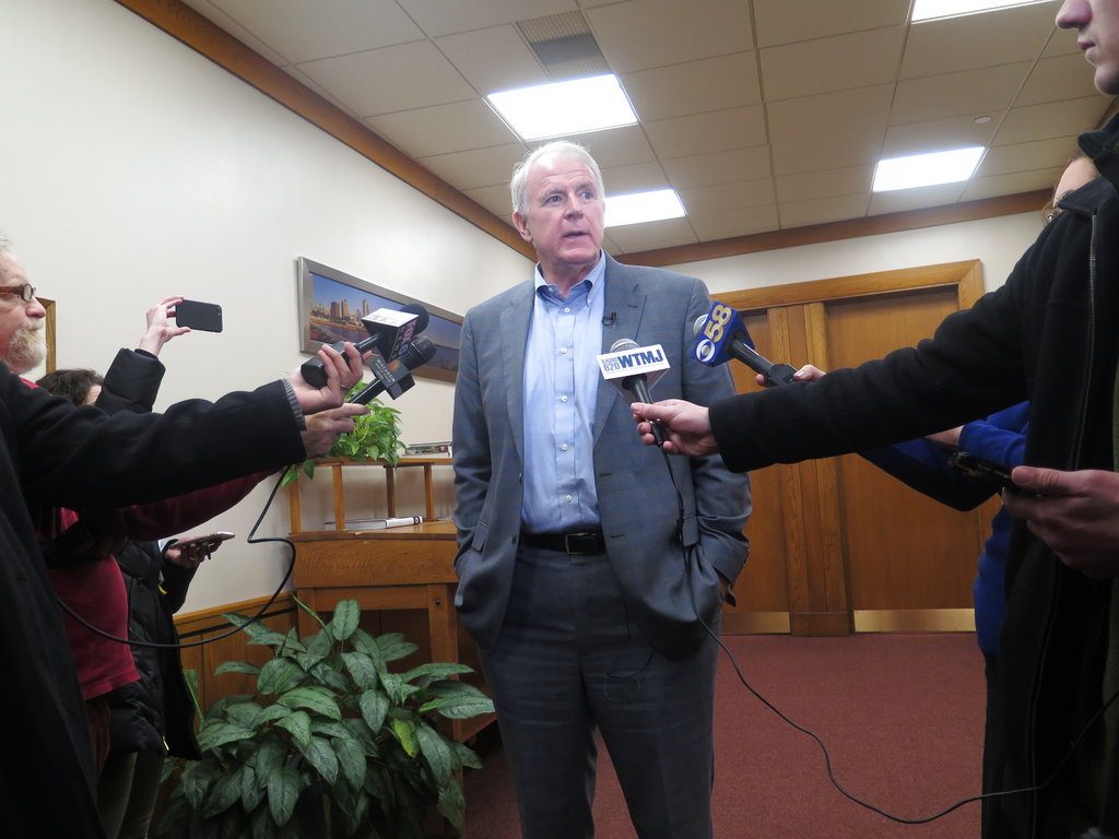 Milwaukee Mayor Tom Barrett speaks to reporters outside his office about the Red Cross asking fire victims in some parts of the city to come to them or a nearby police station on Tuesday, Jan. 2, 2018, in Milwaukee. The Red Cross Milwaukee chapter said the policy change is to address a volunteer shortage, but the move has sparked outrage because the areas affected are low-income and predominantly black and Latino. (AP Photo/Ivan Moreno)