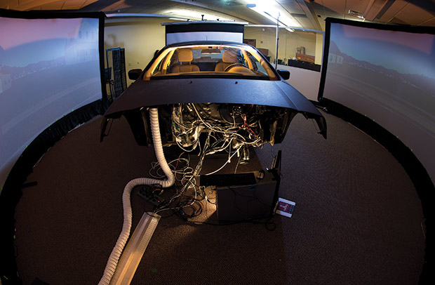 A crash test simulator is wired to a computer to help research autonomous vehicle technology. 