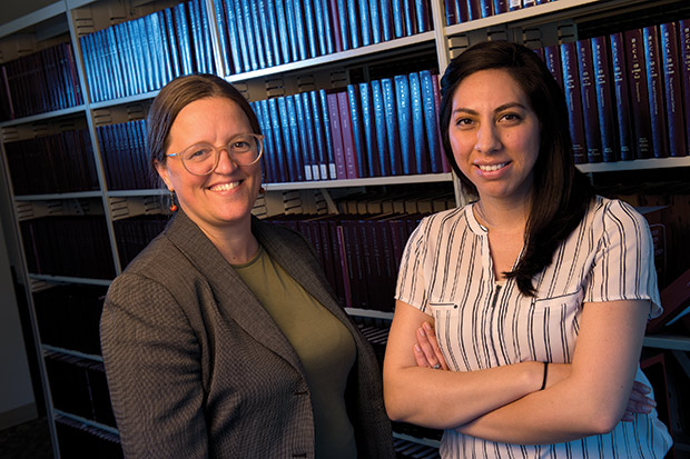 Attorney Heidi Wegleitner (left) and paralegal Rebeka Pritchett of Legal Action’s Dane County Eviction Defense Project work from the library of the Dane County Courthouse on May 8. (Staff photo by Kevin Harnack)